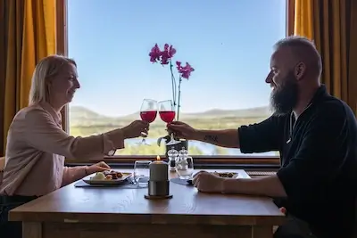 Couple-sit-at-table-Venabu-dining-room